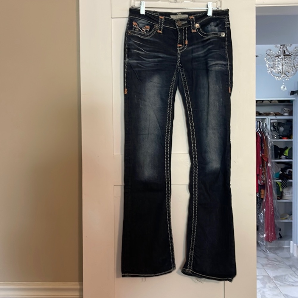 Big star, size 27L, low rise, boot cut jeans. Some wear at the bottom of pants